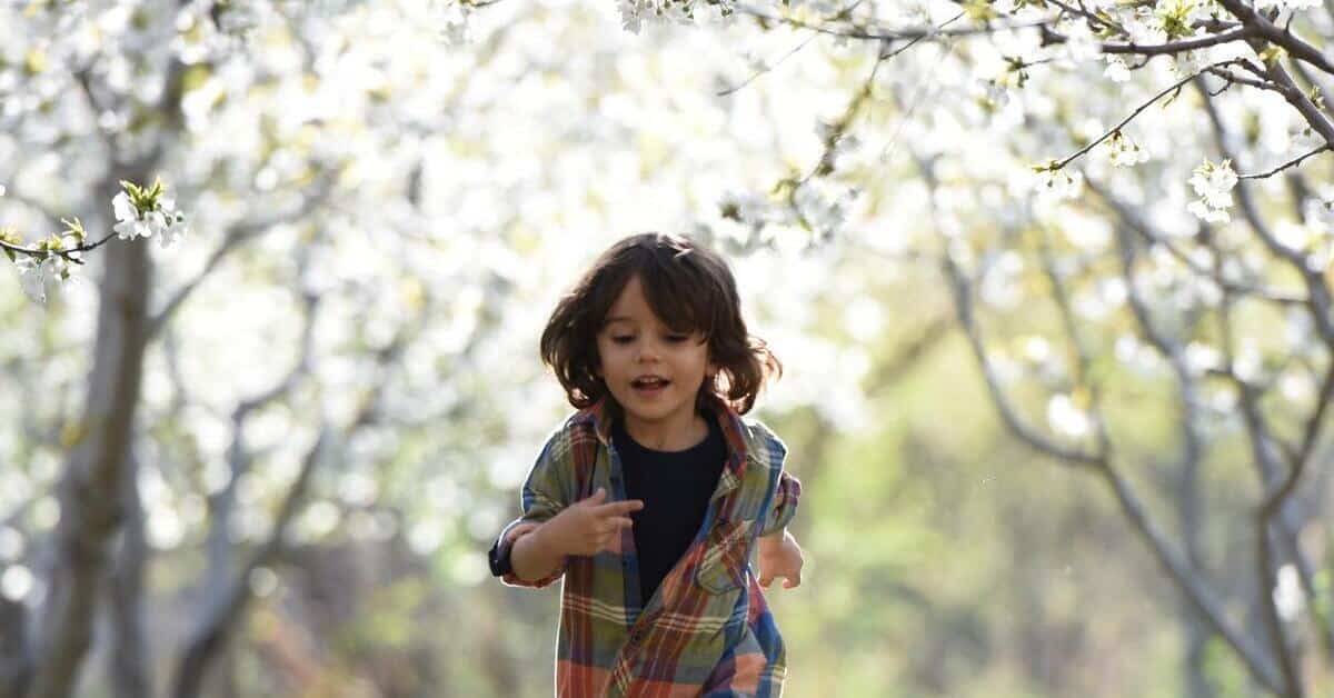 Texan child running in orchard receiving child support