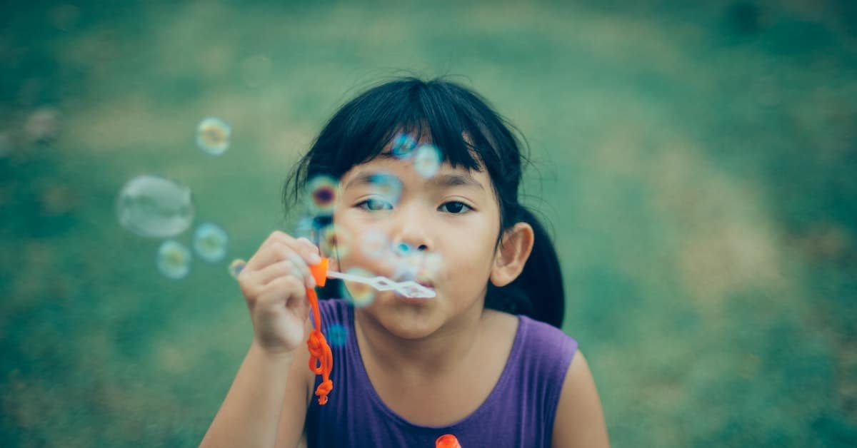 little girl blowing bubbles after texas divorce custody order