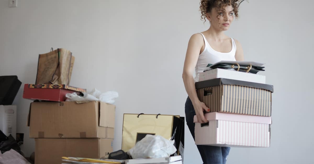 woman moving boxes before filing for divorce in different county in texas