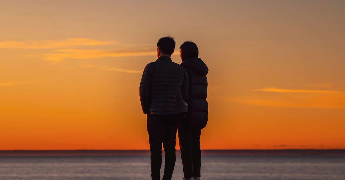 couple standing looking at sunset getting back together through divorce annulment in texas