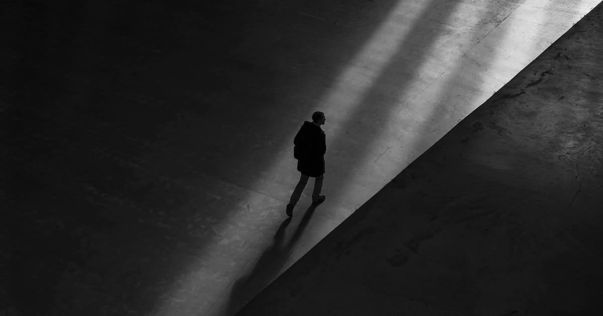 shadowy figure representing missing spouse after divorce and how to deal with removing name from deed