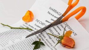 marriage certificate being cut up with flower in texas divorce