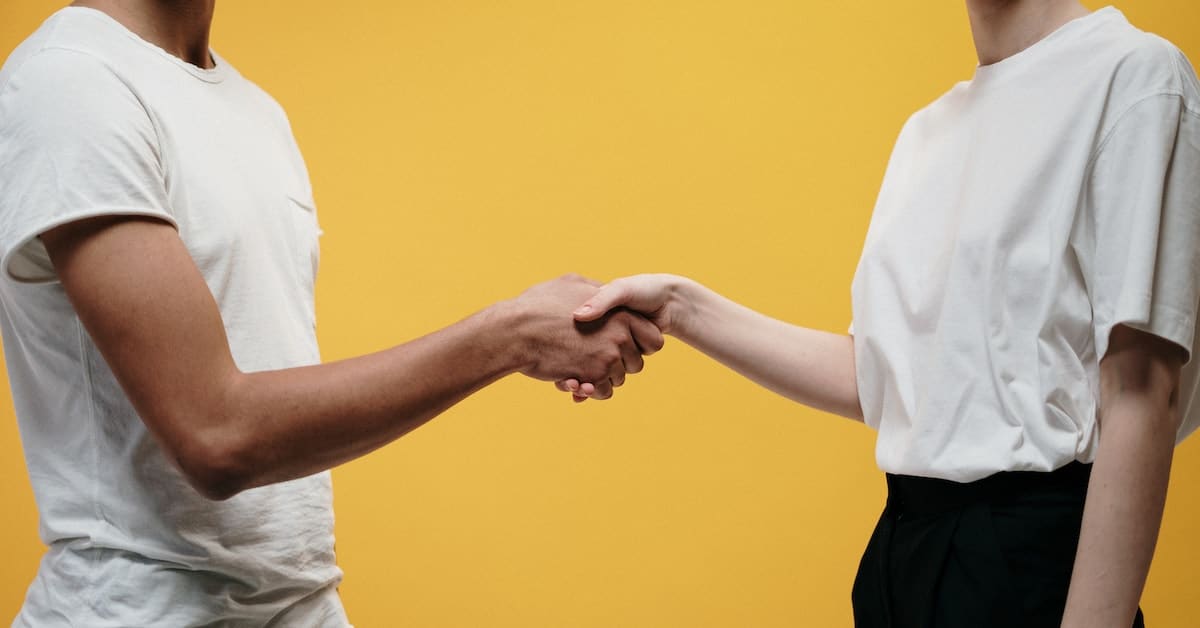 divorcing couple shaking hands during uncontested online divorce in texas