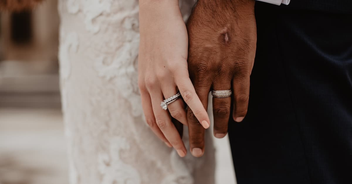 man and woman getting remarried in texas close up of hands with rings