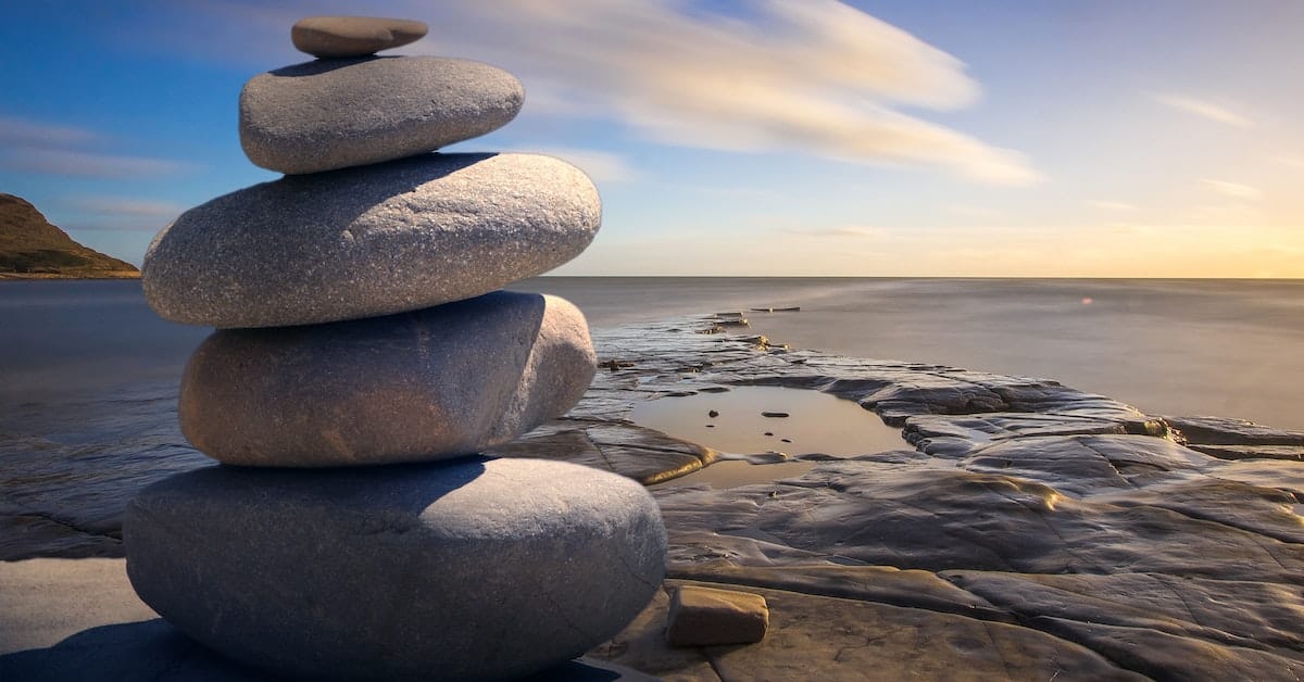 rock cairn on beach as a part of spiritual support in texas divorce