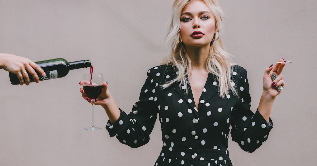 woman with wine in glass, drinking problem as main cause of divorce in texas