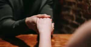 man and woman holding hands having affair in texas divorce