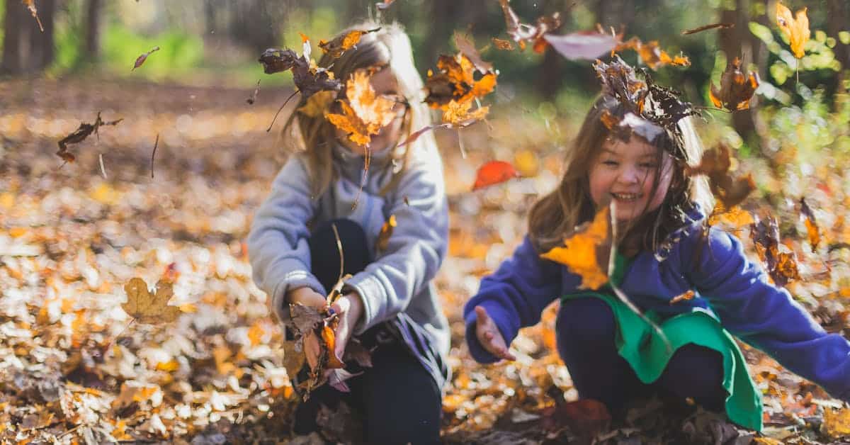 kids playing in leaves changing kids name Name Change After Marriage in Texas: How to Change Your Last Name