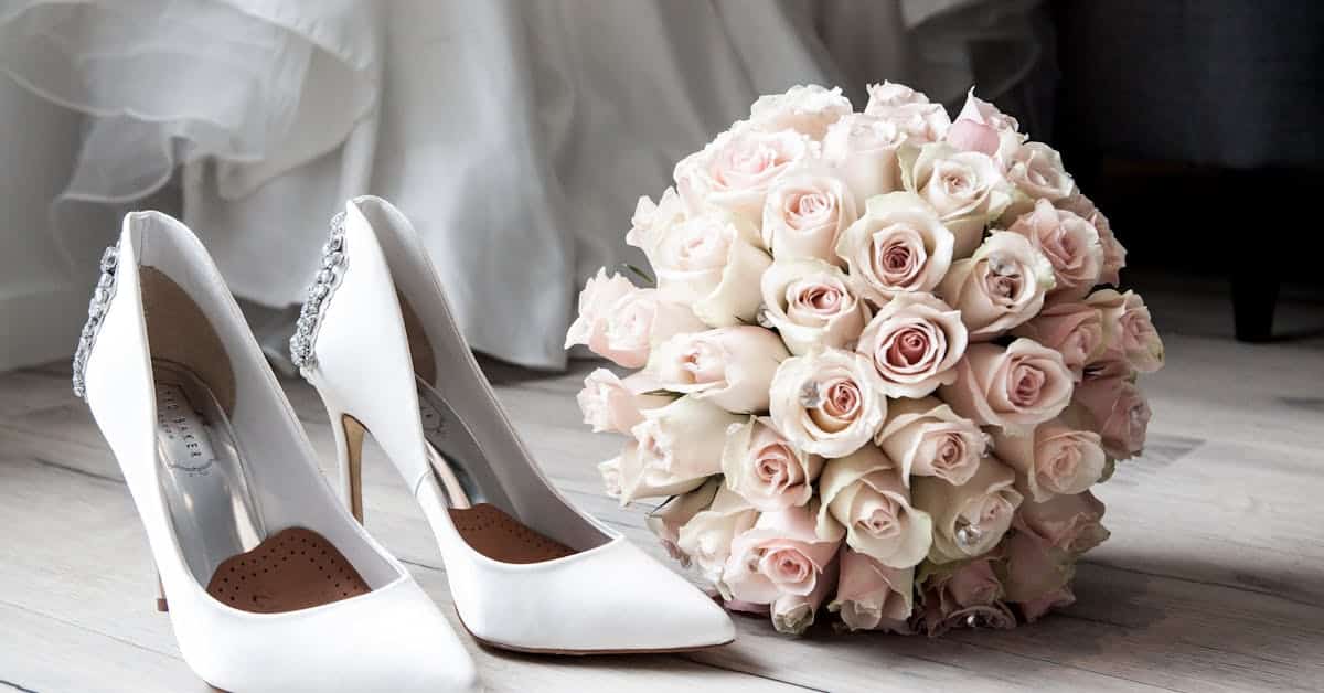 wedding shoes and flowers for couple with marriage contract in texas